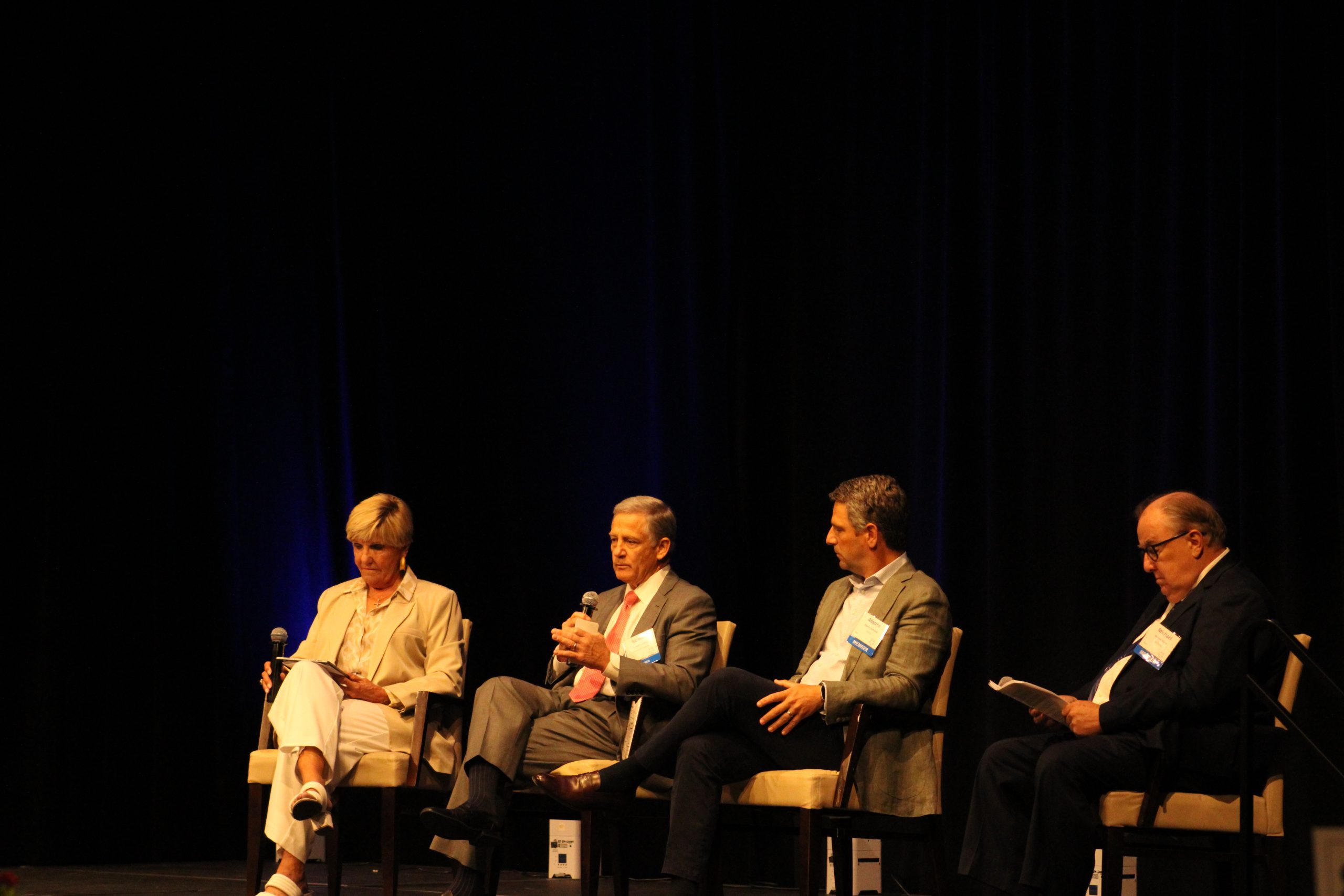 Betsy Price (left), Russell Laughlin, Alberto Gonzalez, and Michael Morris hold a discussion during a North Texas Infrastructure Summit at Hurst Conference Center on Aug 9, 2023, in Fort Worth. (Juan Salinas II | Fort Worth Report)